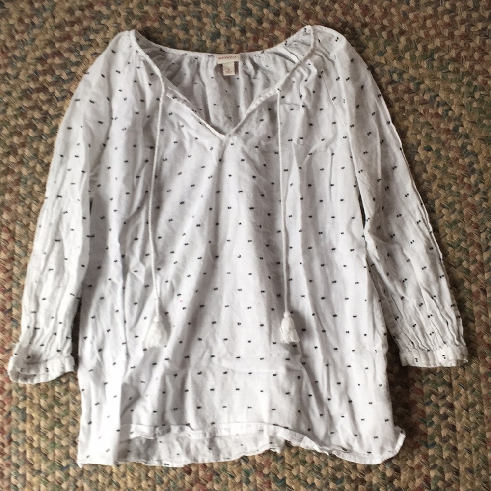 White long sleeve blouse with draw strings.